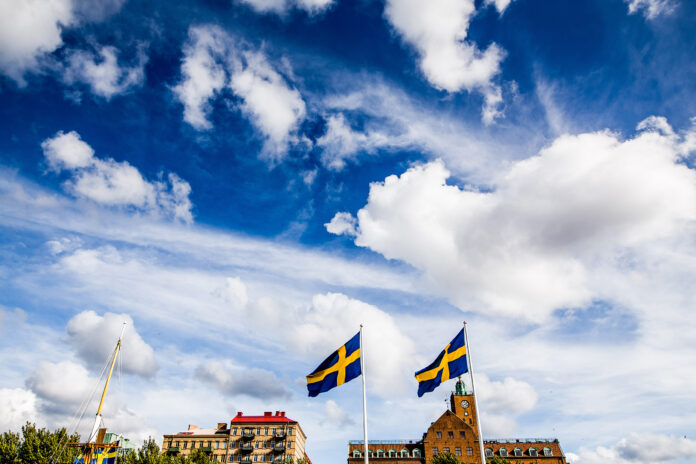 Swedish Flags Flying Over Historic Buildings, Gothenburg, Sweden Swedish Flags Flying Over Historic Buildings, Gothenburg, Sweden