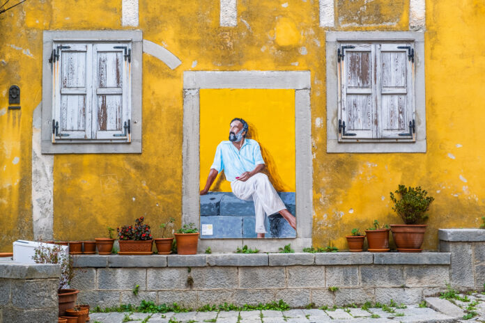 Art Mural on Yellow Wall in Labin Art Mural on Yellow Wall in Labin